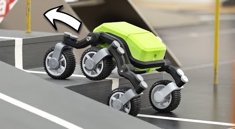 Image of a small robot with 4 wheels climbing stairs
